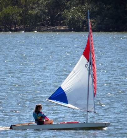 Girl sailing Sunfish