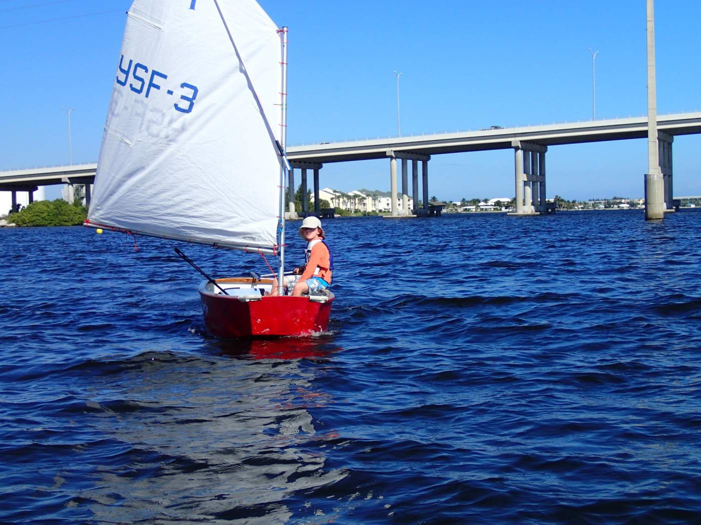 Youth Sailor with bridge in background