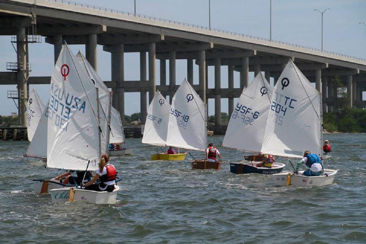 Many Youth Sailors with bridge in background