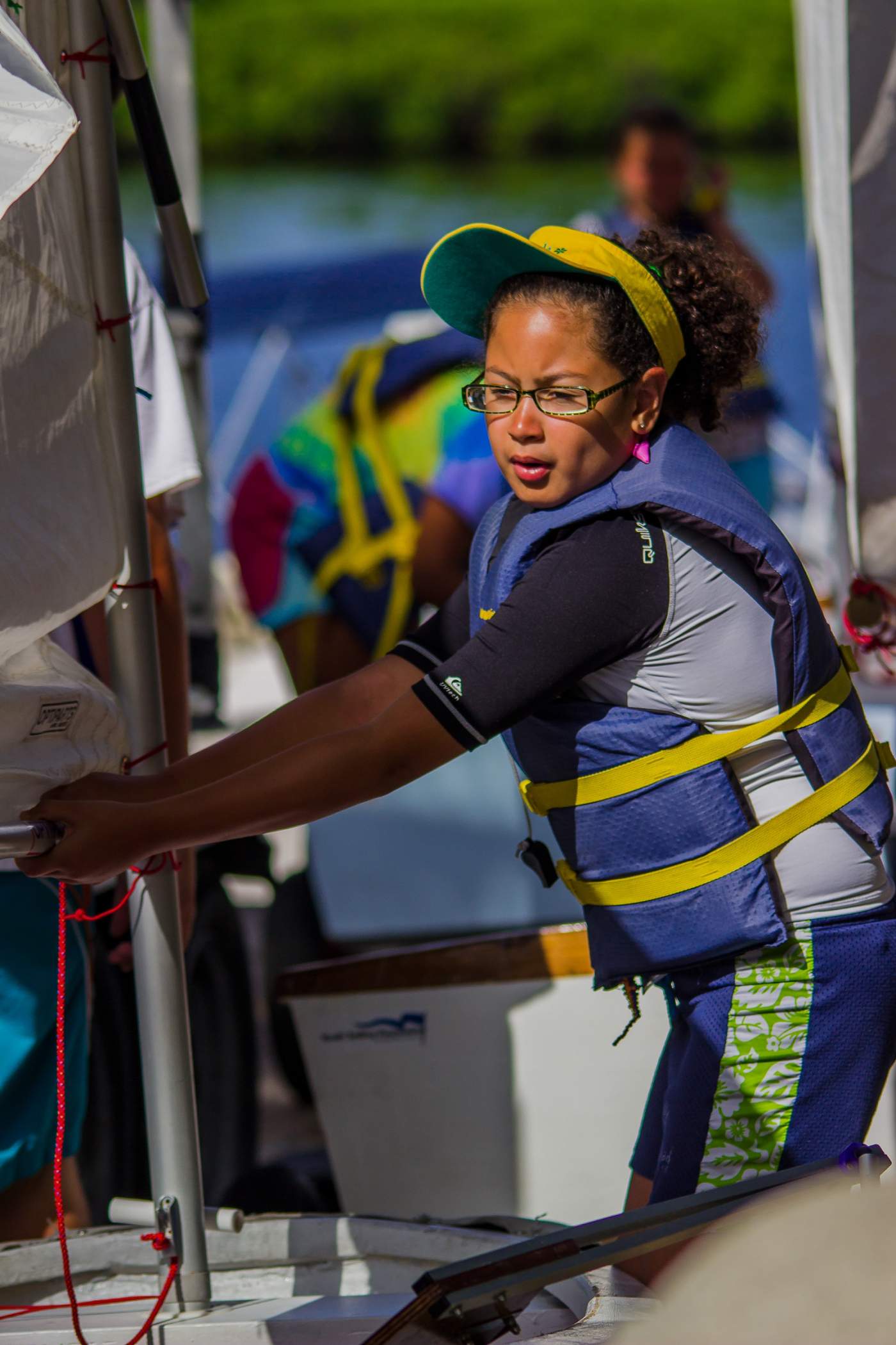 Youth Sailor working on her boat